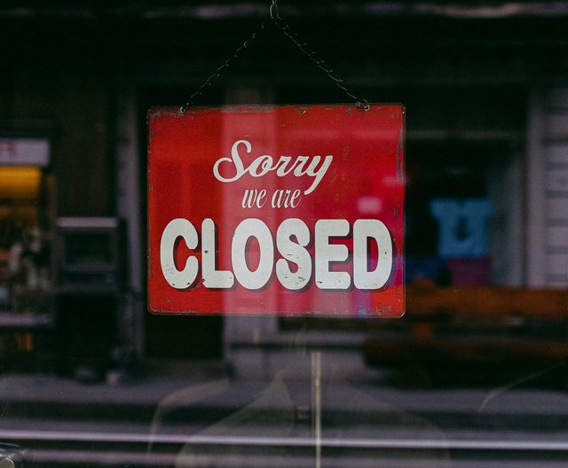 Sign reading 'sorry, we're closed'
