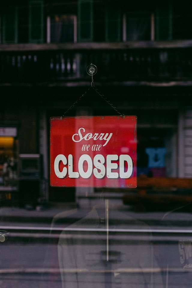 Sign reading 'sorry, we're closed'